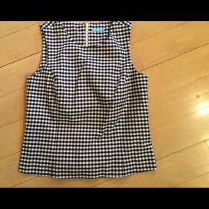 Sleeveless black and white checked top.